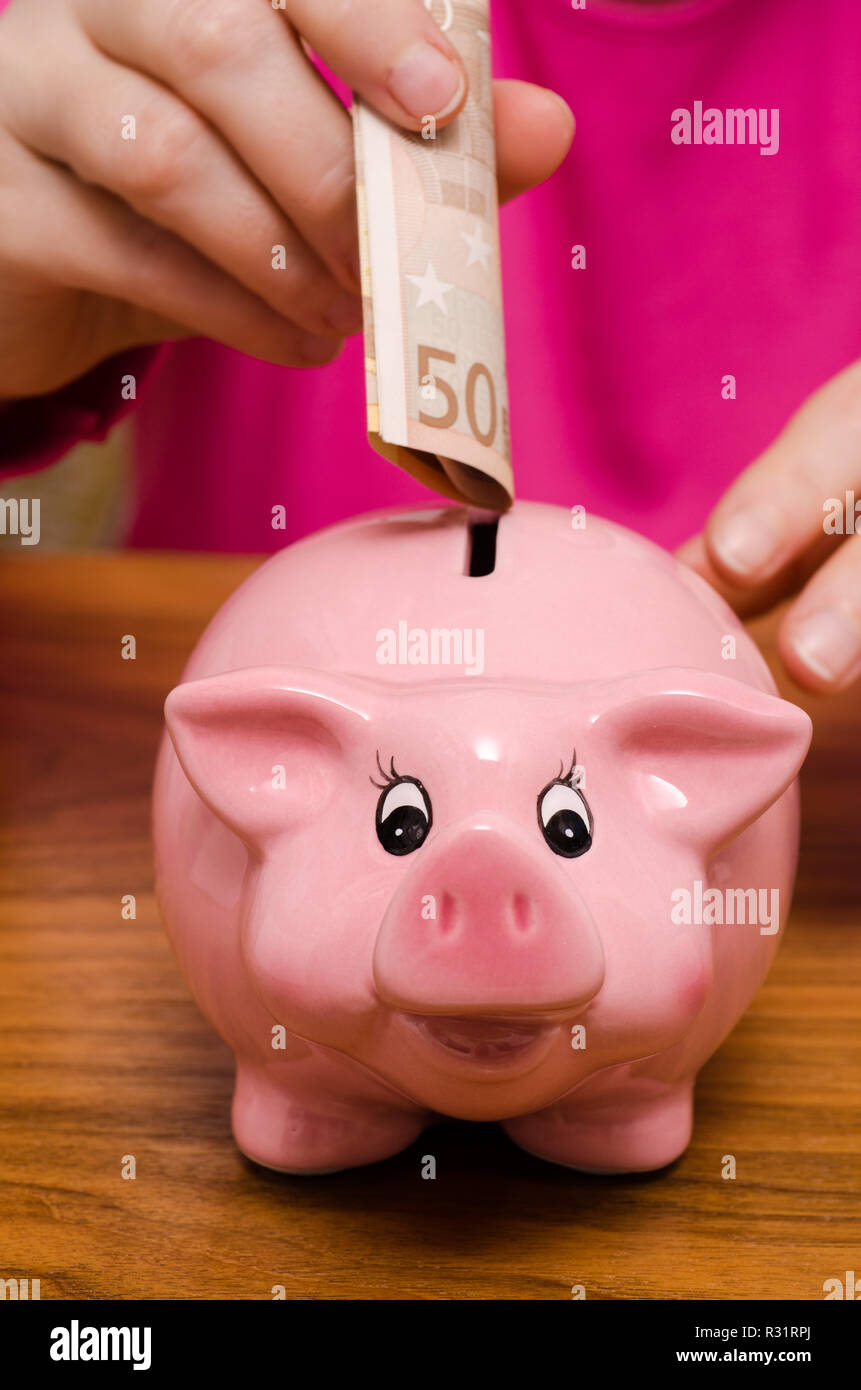 Tirelire et 50 euro note Banque D'Images