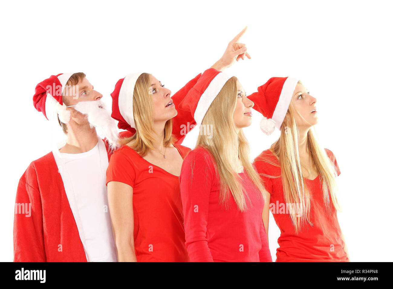 Groupe de personnes en costumes de Noël regardez en l'air Banque D'Images