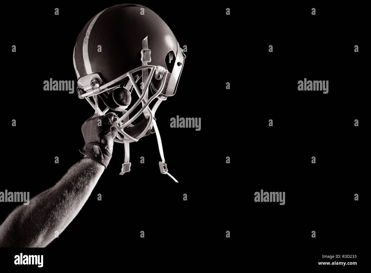 American football player cheering avec jusqu'à bras Banque D'Images