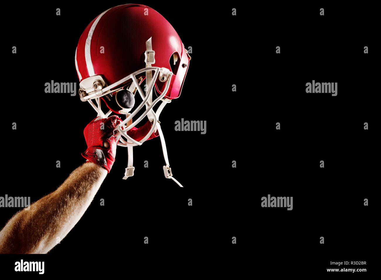 American football player cheering avec jusqu'à bras Banque D'Images