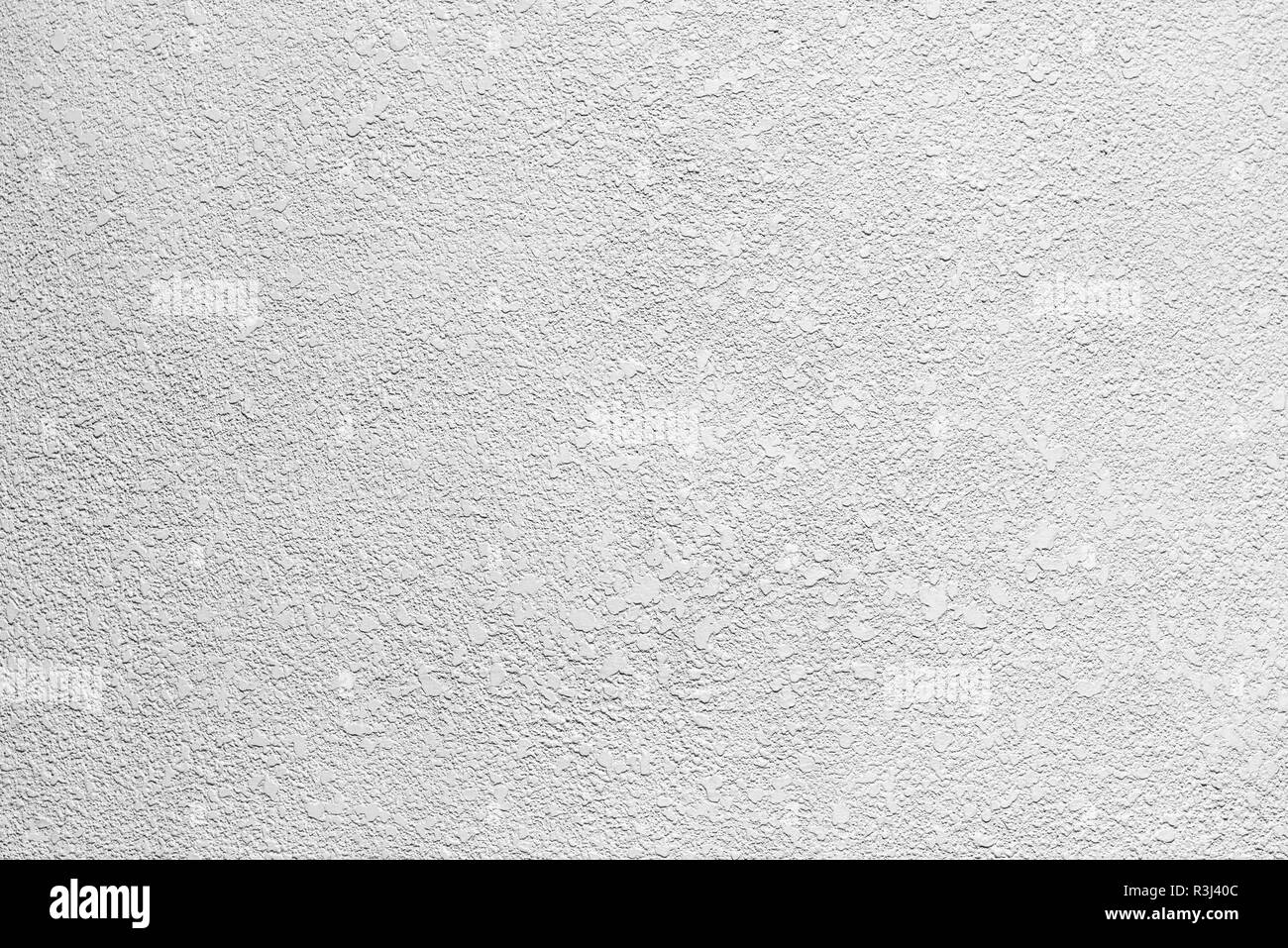 Mur de béton blanc grunge sale et fissuré avec arrière-plan. À partir de l'arrière-plan détaillé de haut mur de pierre de fragment. La texture du ciment. Mur de béton gris. Banque D'Images