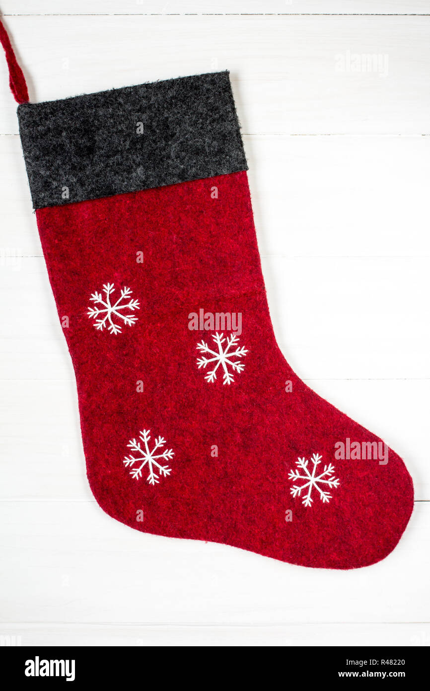 Chaussette de Noël rouge avec des flocons Banque D'Images