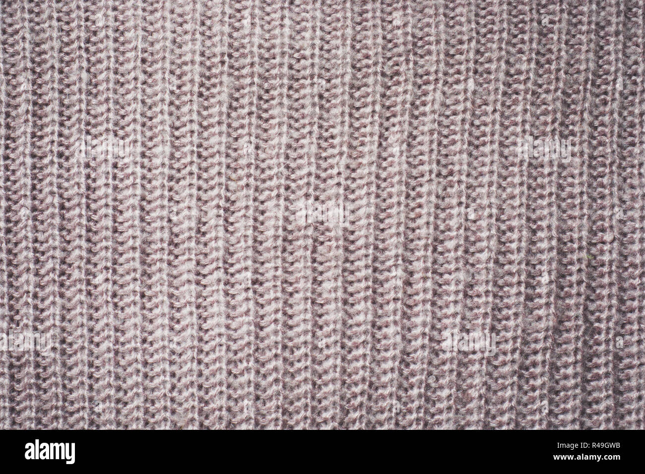 Texture Tissu Tricot Beige transparente avec des nattes. Fond en tricot beige Banque D'Images