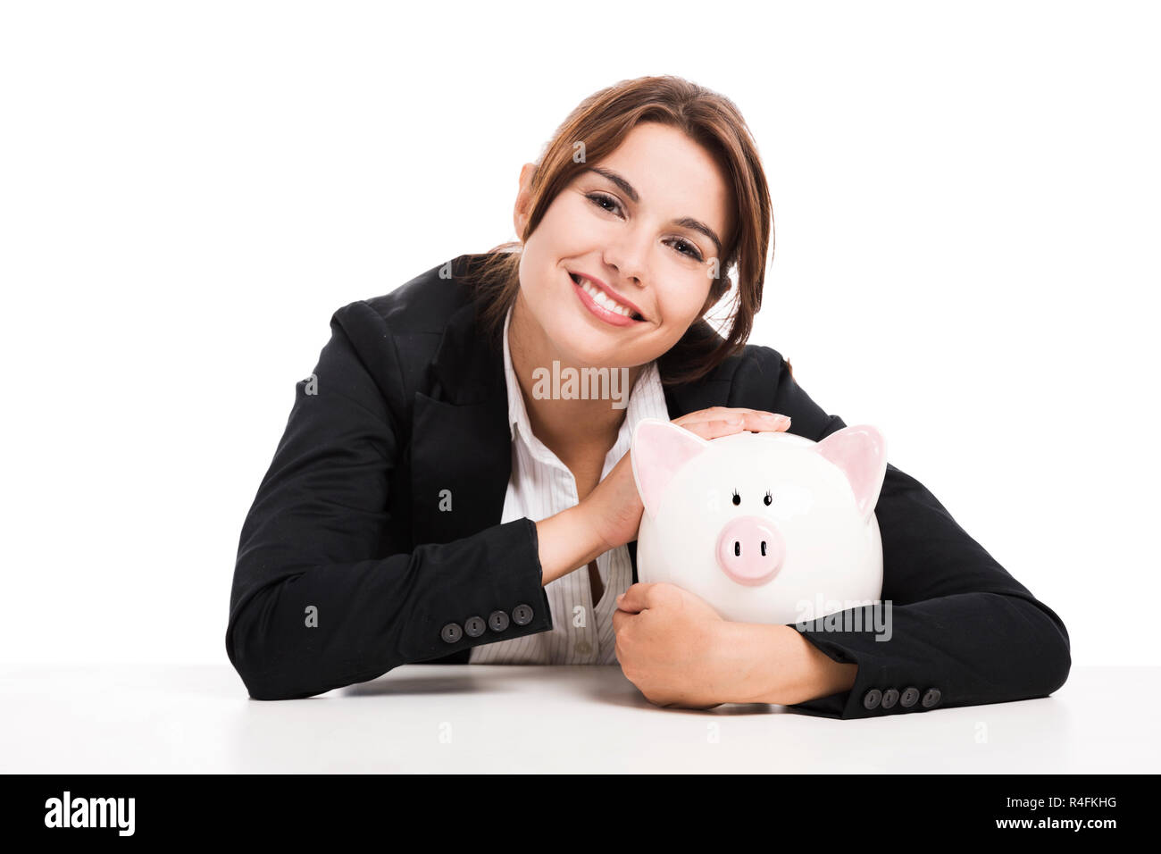 Businesswoman with a piggy bank Banque D'Images
