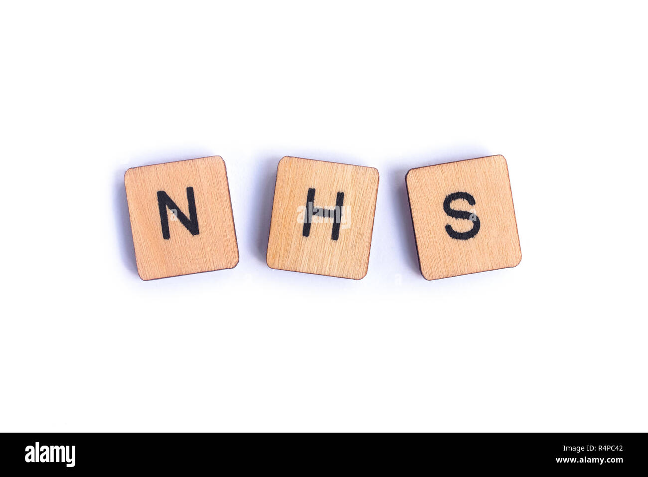 Londres, UK - 7 juillet 2018 : l'abréviation NHS - National Health Service - l'épeautre avec lettre en bois, tuiles de SCRABBLE le 7 juillet 2018. Banque D'Images