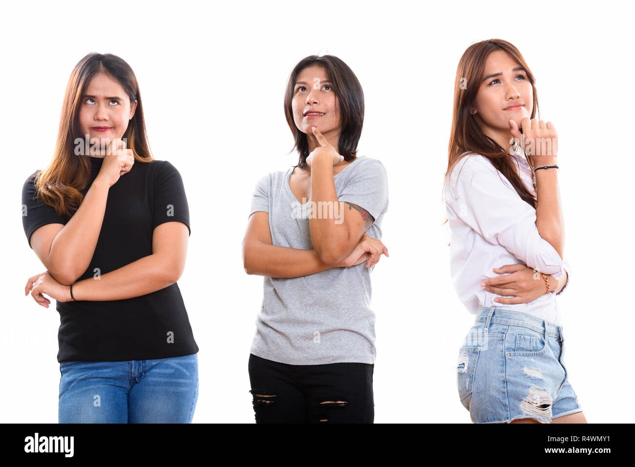 Portrait de trois jeunes amis femme asiatique tout en pensant lo Banque D'Images