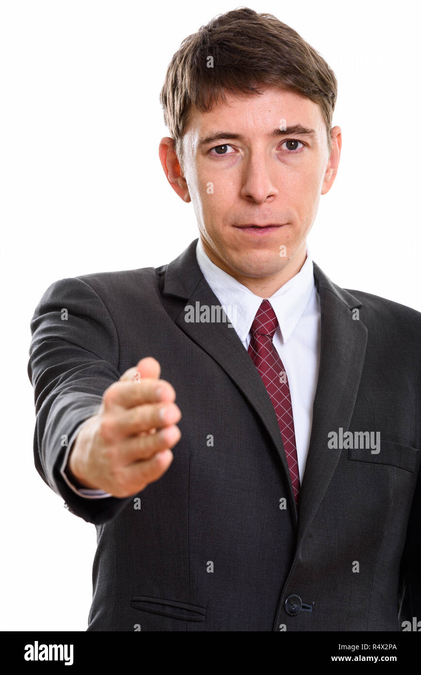 Studio shot of businessman giving handshake pour accord Banque D'Images