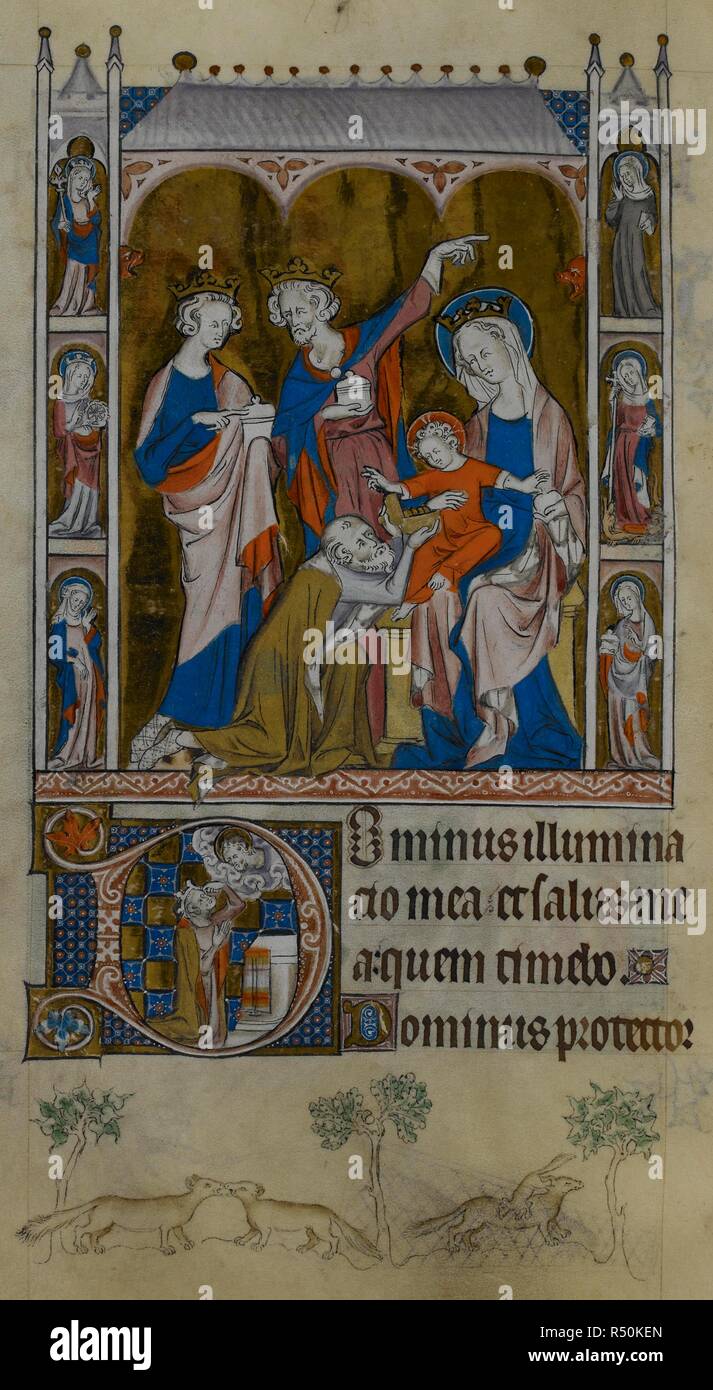 Adoration des Mages, l'un à genoux, l'autre dirigée vers l'enfant, et le troisième à une étoile qui n'est pas illustré. L'enfant Jésus, la main posée dans l'oraison, est assis sur les genoux de Marie. Elles sont encadrées de chaque côté par six femmes saints dans les niches, y compris la Vierge avec couronne et sceptre, St Catherine avec une roue, St Margaret tenant une croix longue qui perce un dragon à ses pieds, et St Marie Madeleine avec un pot onguent. Psautier de la reine Mary. Angleterre (Londres) ; années 1310-1320. Source : Royal 2 B. VII, f.112 v. Langue : le latin. Banque D'Images