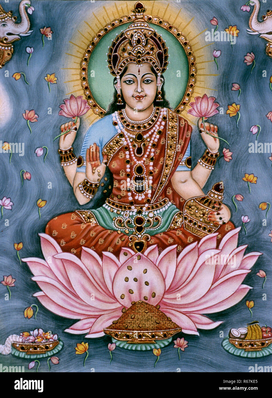 La déesse Lakshmi bénédiction assis tenant la peinture miniature de fleur de lotus sur papier Banque D'Images