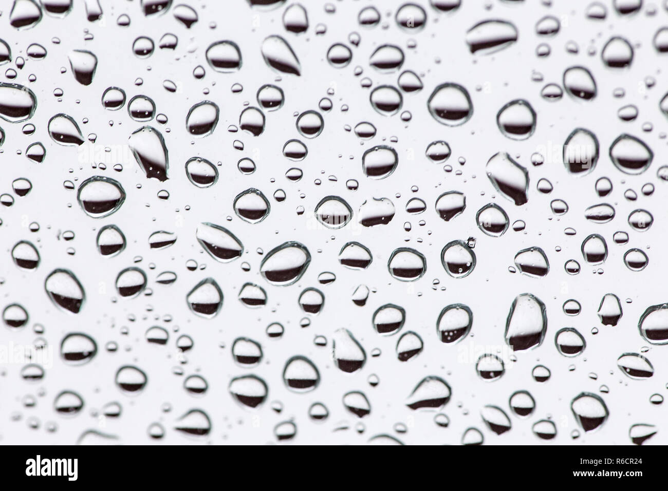 Gouttes de pluie sur la vitre de l'arrière-plan, texture de fond goutte d'eau. Banque D'Images