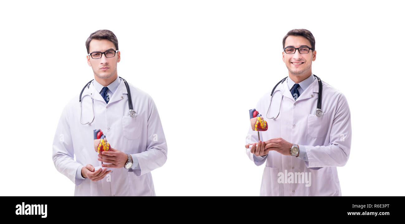 Jeune médecin avec forme de coeur isolated on white Banque D'Images