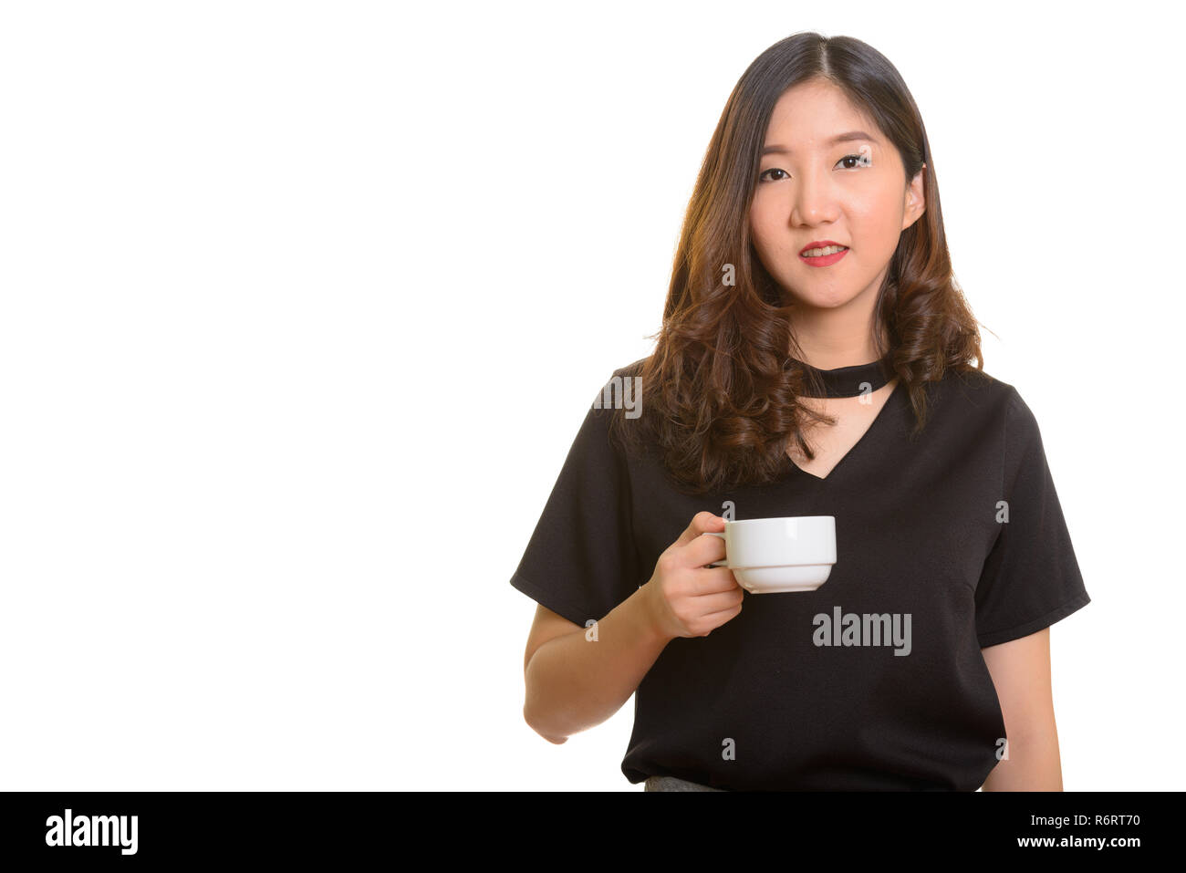 Jeune belle Asian businesswoman holding Coffee cup Banque D'Images