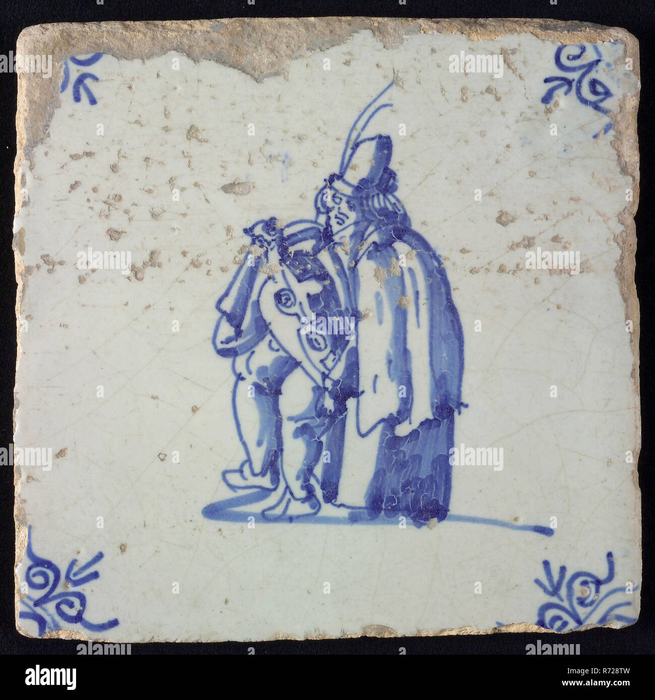 La figure mosaïque, bleu avec homme assis avec instrument de musique, motif d'angle de la tête de bœuf, tuile de mur en céramique, sculpture en terre cuite glaçure 2x vitrage Rotterdam peint vielle lyre music provenant de la cheminée du . Van Hoynck Papendrecht ancien directeur du Musée des Antiquités de Rotterdam. Banque D'Images