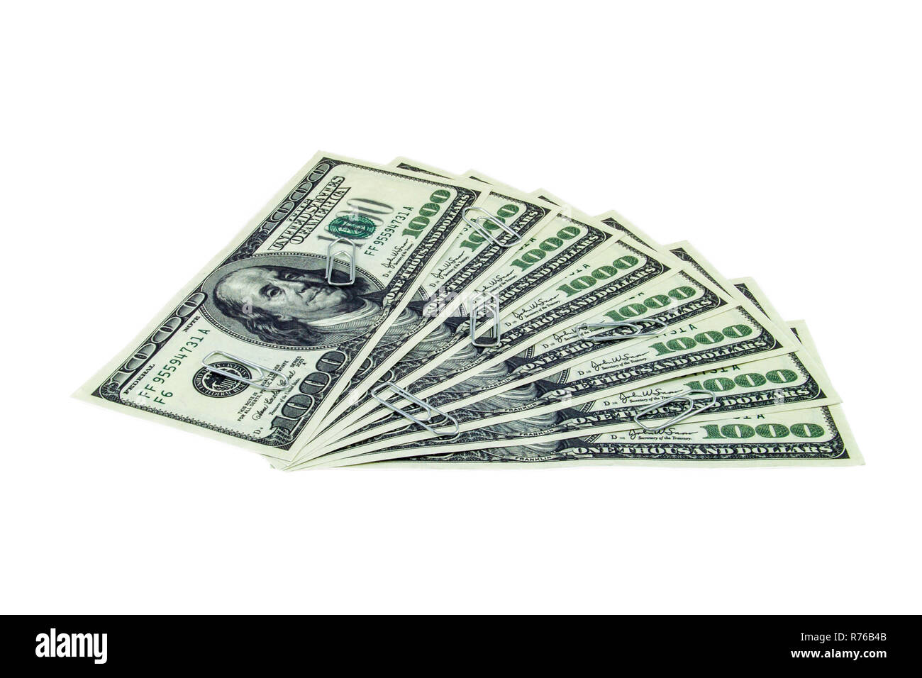 Trombones spreaded plus d'un millier de dollars isolé sur fond blanc Banque D'Images Trombones spreaded plus d'un millier de dollars isolé sur fond blanc Banque D'Images