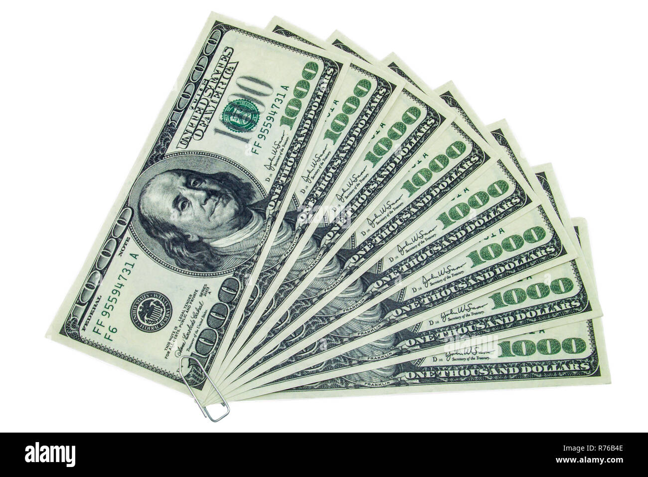 Paper-clipped mille dollar bills organisés comme fan sur un fond blanc Banque D'Images Paper-clipped mille dollar bills organisés comme fan sur un fond blanc Banque D'Images