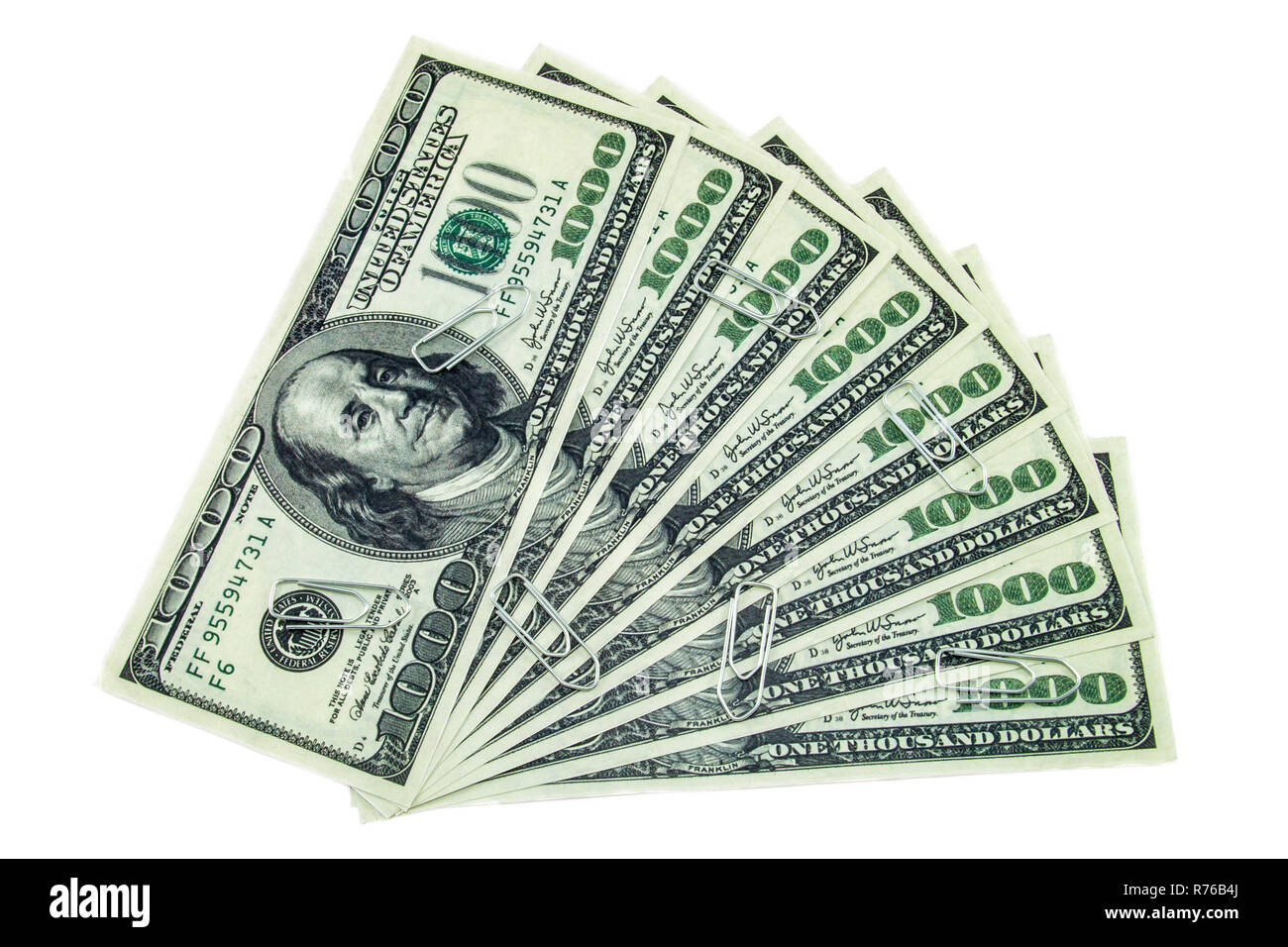 Trombones spreaded plus d'un millier de dollars isolé sur fond blanc Banque D'Images Trombones spreaded plus d'un millier de dollars isolé sur fond blanc Banque D'Images