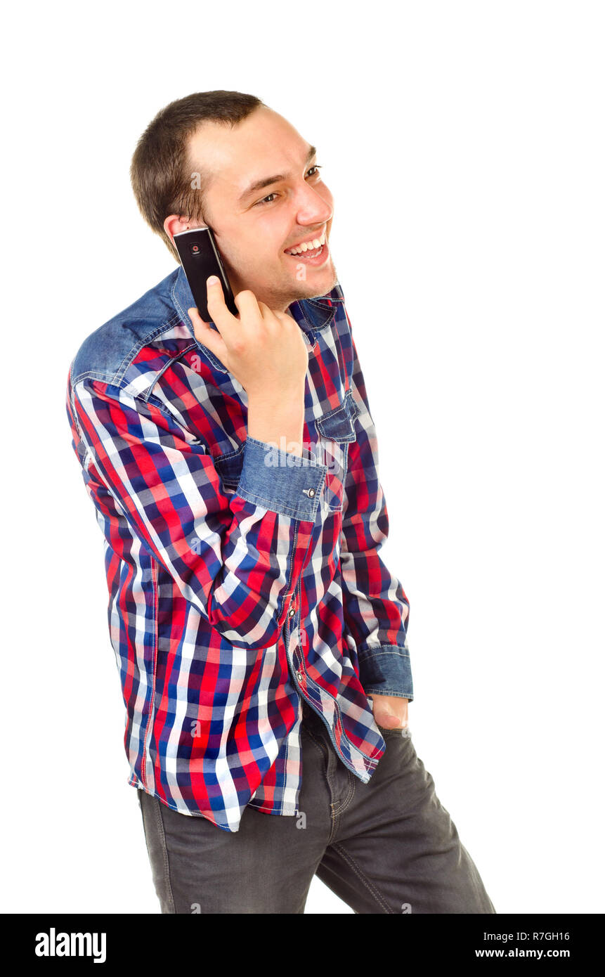 Young man with mobile phone isolated on white Banque D'Images
