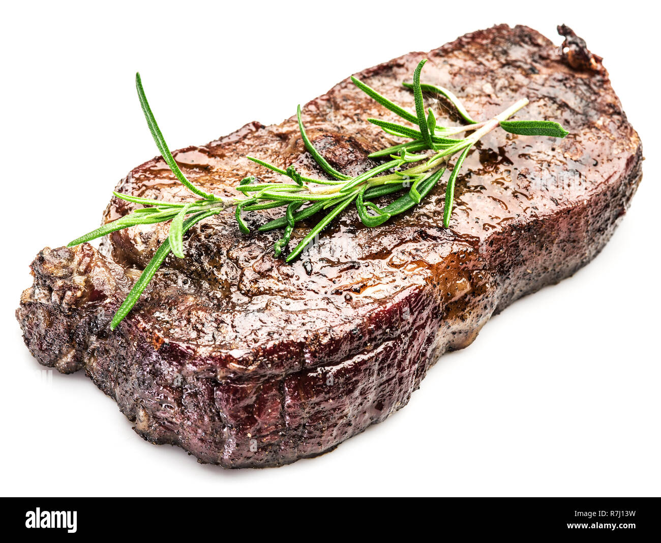 Ribeye Steak aux épices sur le fond blanc. Banque D'Images