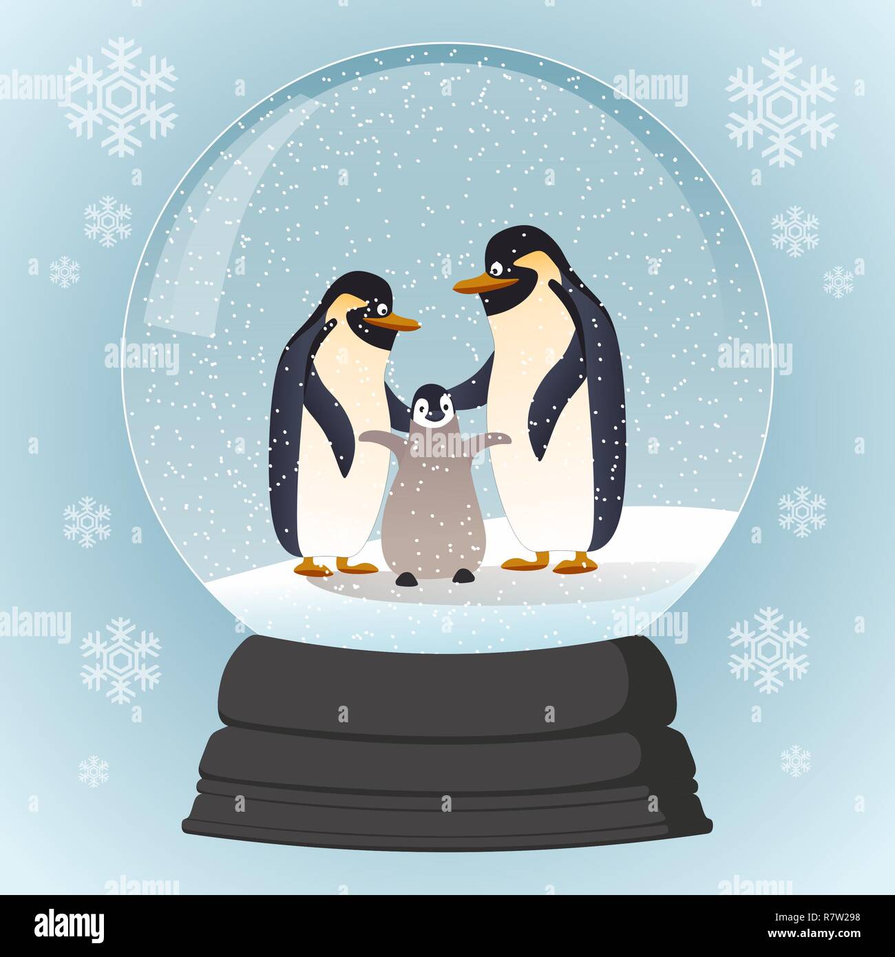 Noël en verre-ball avec la famille pingouins Banque D'Images