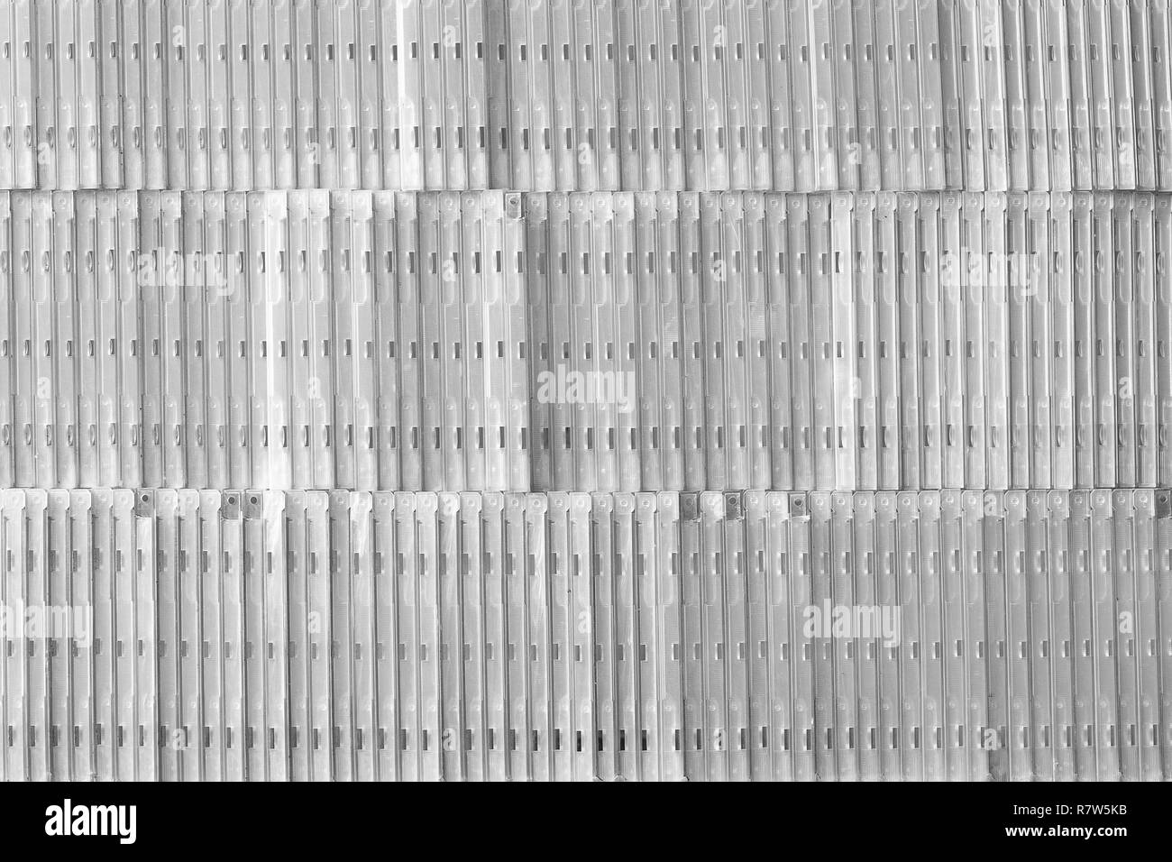 Fond gris. Arrière-plan de la musique. Mur de boîtiers CD Banque D'Images