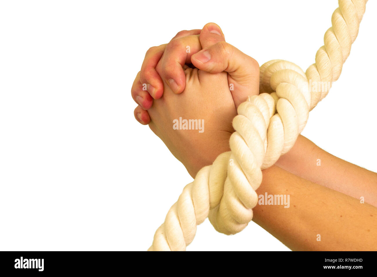 Liaison corde man's hands. Isolé sur fond blanc. Banque D'Images