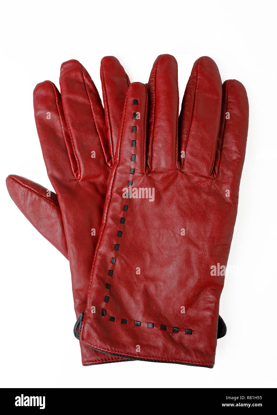 Paire de gants de couleur rouge rouille sur blanc. Banque D'Images