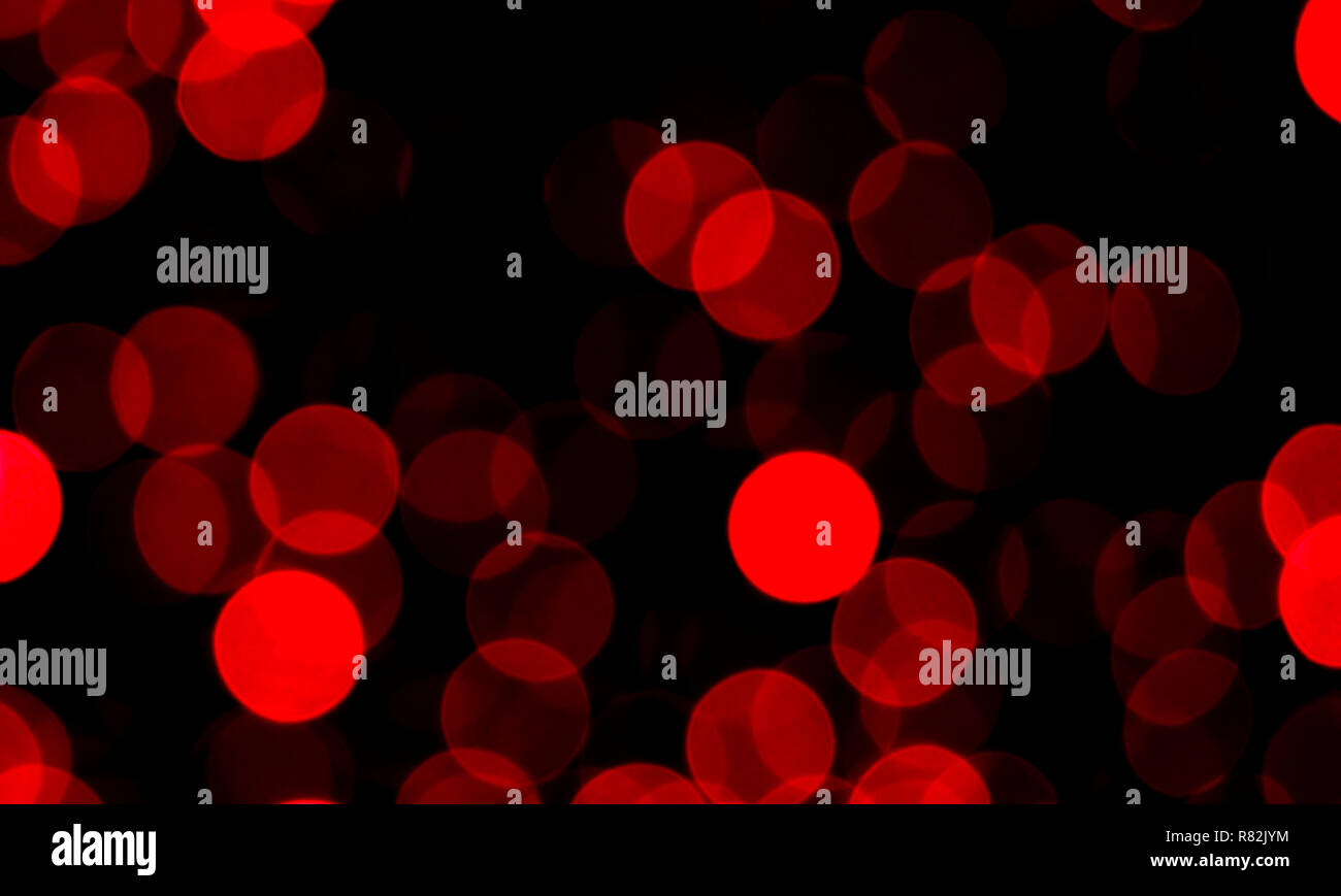 Lumière rouge flou abstrait ornement, beaucoup de points brillants dans la nuit, Noël arrière-plan Banque D'Images