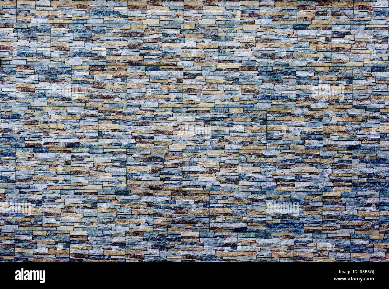 Pierre moderne mur texture background. Type de mur de brique pierre surfacés. Photo couleur Banque D'Images