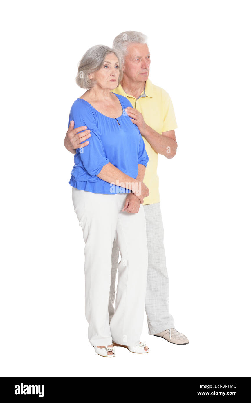 Portrait of cute happy senior couple at white background Banque D'Images