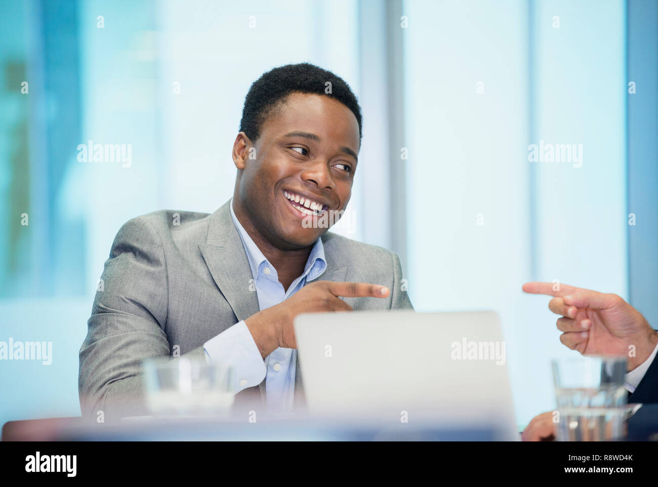 Smiling businessman in meeting Banque D'Images