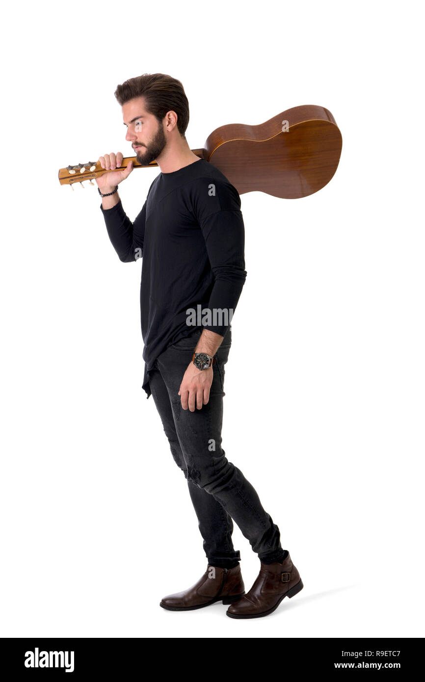 Full Length Portrait of Young Man Playing Guitar in Studio Banque D'Images