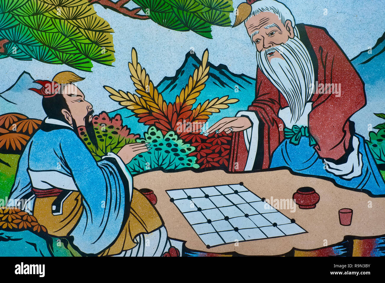 Une peinture sur le mur extérieur du Sanjao Tha Ruea, un temple Taoïste à Tha Ruea, Phuket, Thaïlande, montrant une scène historique d'un jeu d'échecs chinois Banque D'Images
