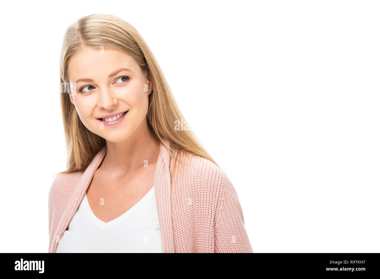 Beautiful smiling blonde woman in cardigan rose isolated on white Banque D'Images