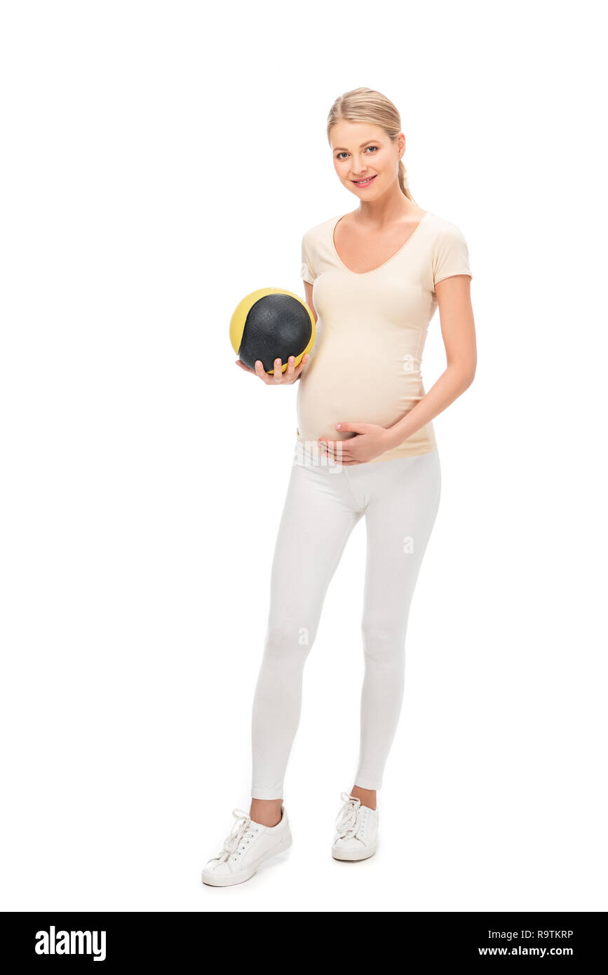 La longueur totale des femmes enceintes blond woman holding ball isolated on white Banque D'Images