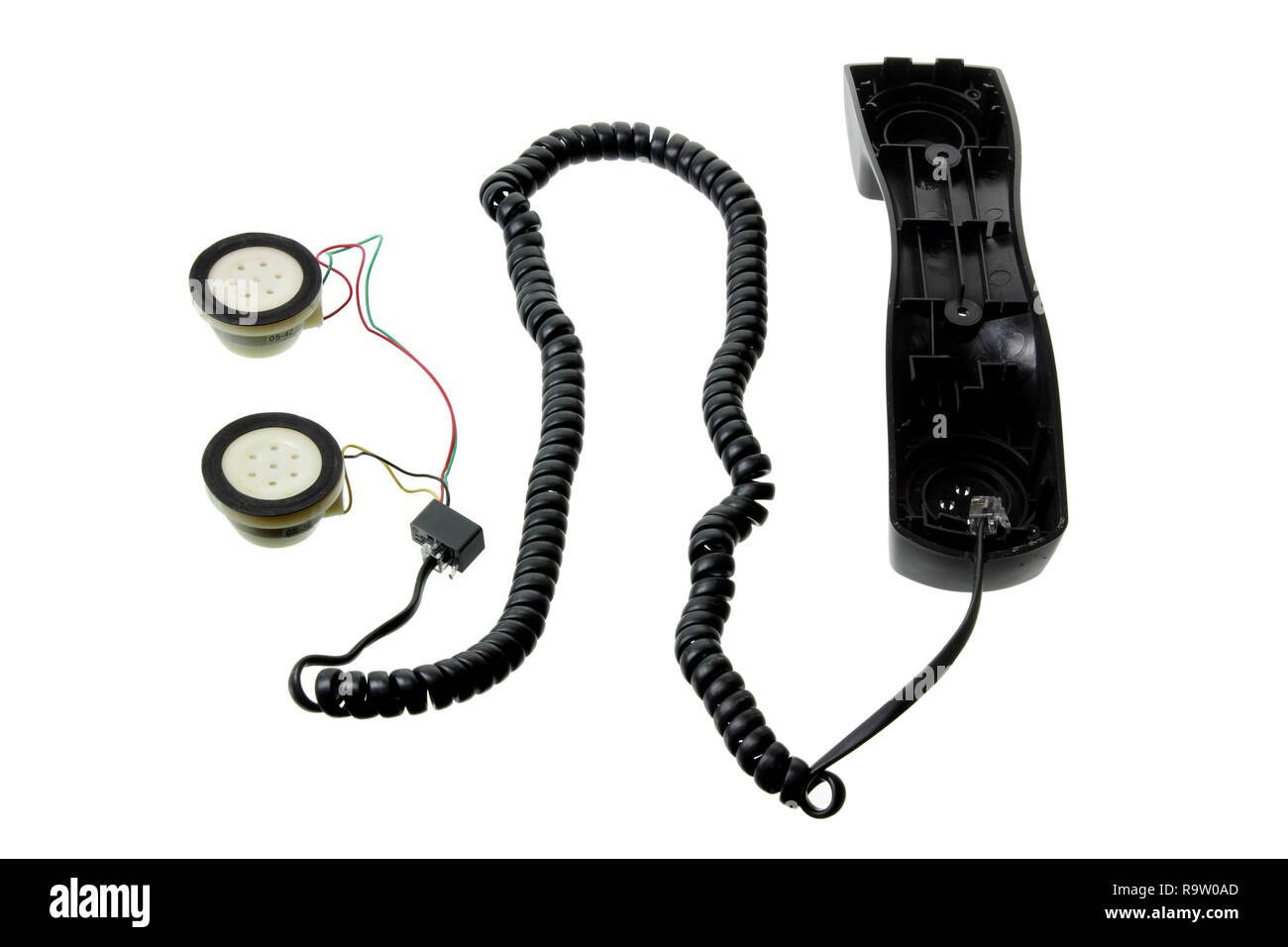 Combiné téléphonique brisée sur fond blanc Banque D'Images