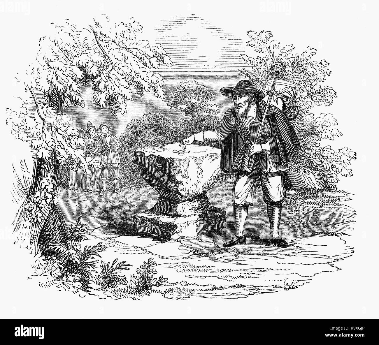 Un voyageur près de la pierre large légendaire situé à Retford, une ville de marché dans le Nottinghamshire dans les East Midlands de l'Angleterre, avait un creux dans ce que l'habitude d'être rempli avec du vinaigre pendant les temps de peste pour désinfecter les pièces de monnaie. Cependant, il est pensé pour être la base d'une tournée vers la borne frontière - peut-être la "Croix" ominie. Banque D'Images