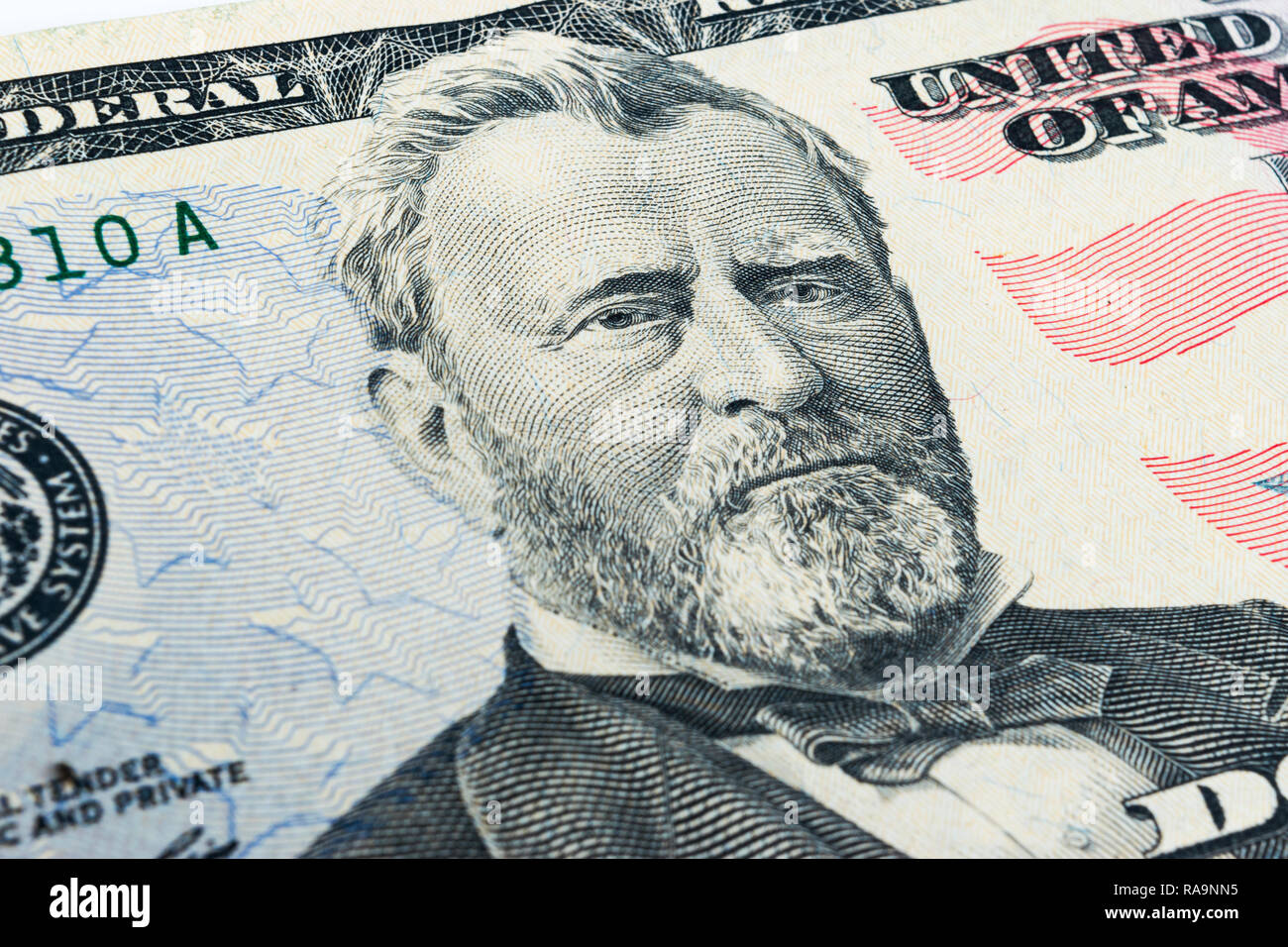 Ulysses S. Grant visage sur cinquante dollars US ou 50 loi macro, united states argent libre. Tas de 50 cent billets d'un dollar sur fond d'argent. Banque D'Images