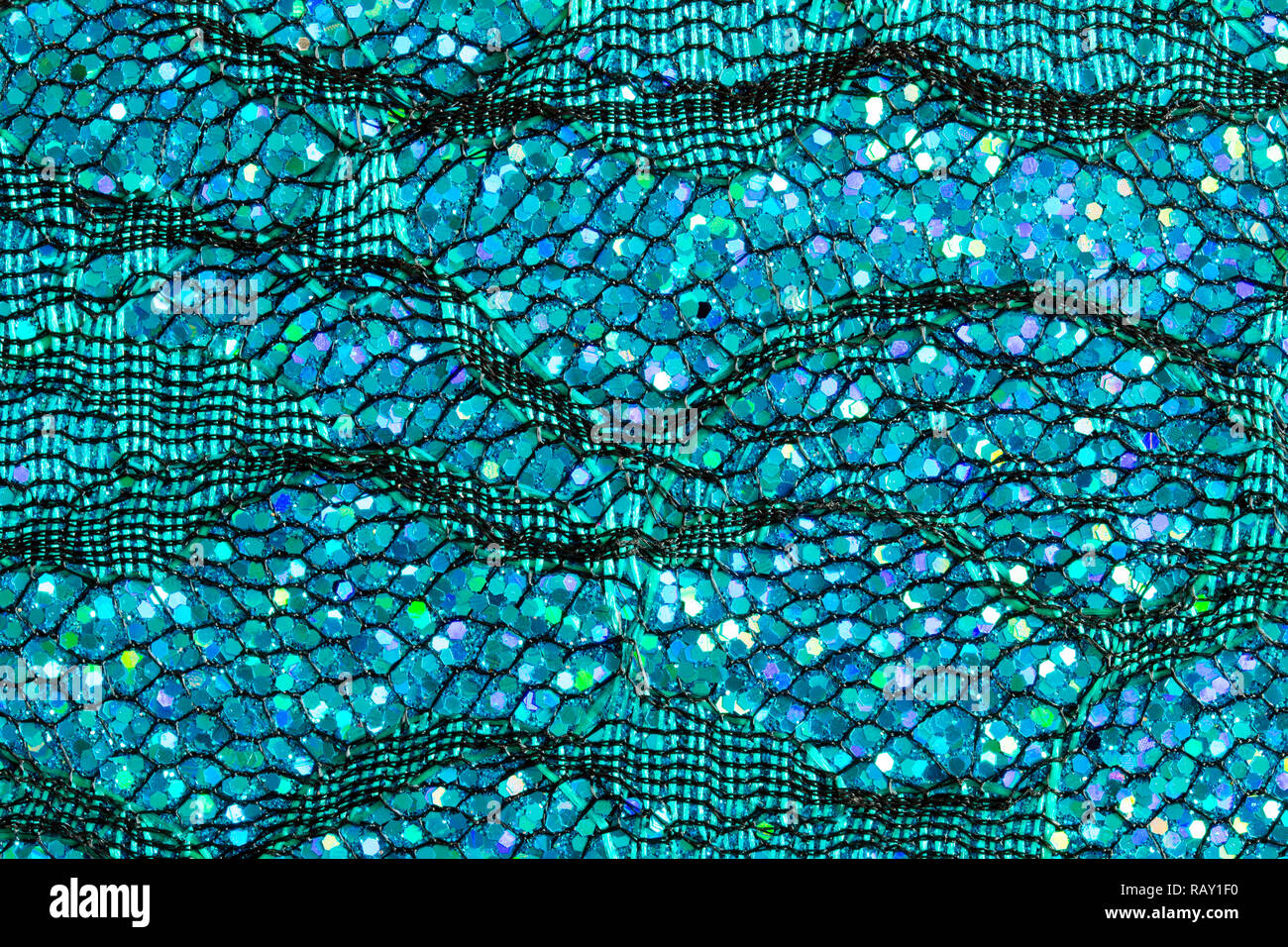 Résumé fond de paillettes bleu sur la dentelle qui ressemble à de l'eau ou les écailles de poisson Banque D'Images
