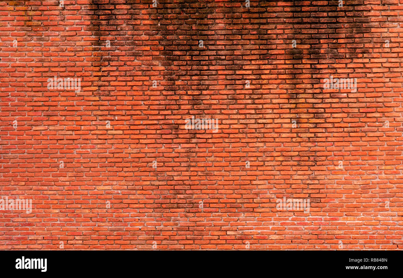 Mur de brique Orange texture background. Arrière-plan de texte. Architecture extérieure concept. Mur de brique orange sale abstract background. Pour l'arrière-plan Banque D'Images