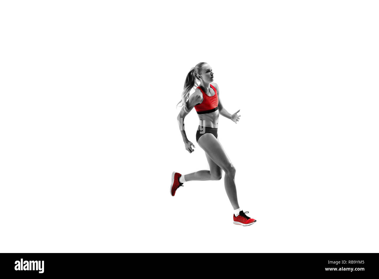La silhouette féminine caucasienne un coureur de courir et sauter sur fond blanc studio. Le sprinter, jogger, exercice, entraînement, fitness, formation, concept de jogging. Banque D'Images