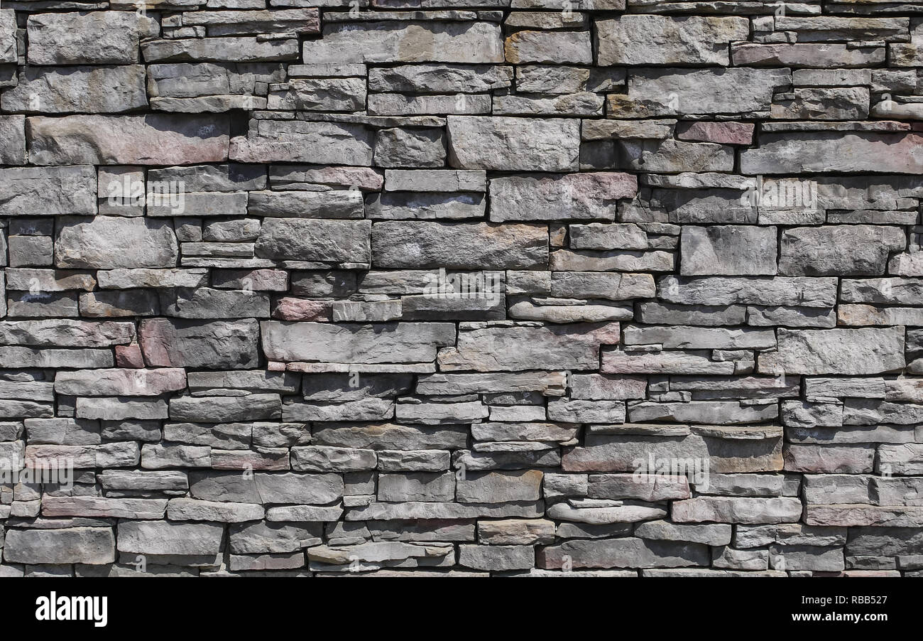 Motif décoratif de la pierre à la surface du mur. Texture de fond en pierre. Banque D'Images
