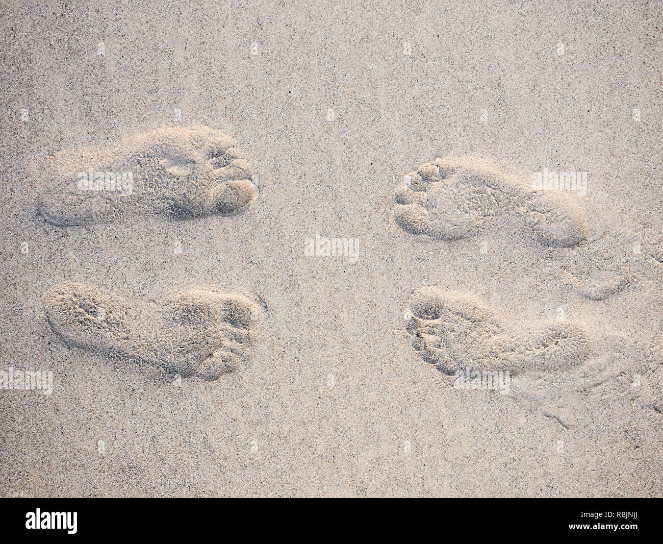 Des traces de pas dans le sable de plage Banque D'Images