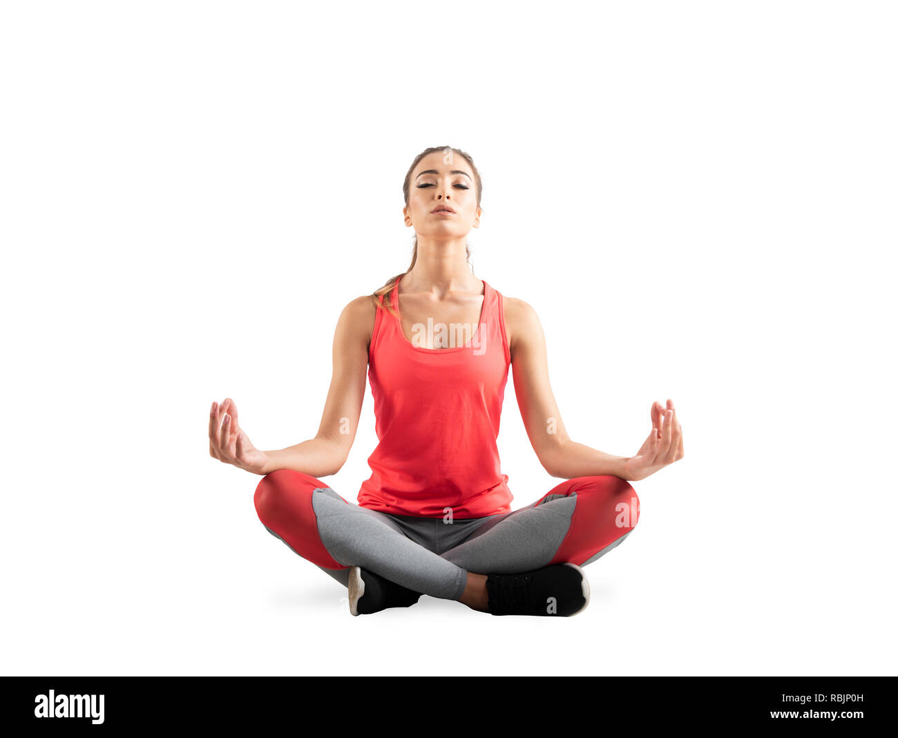 Young Girl relaxing in yoga position. Isolé sur fond blanc Banque D'Images