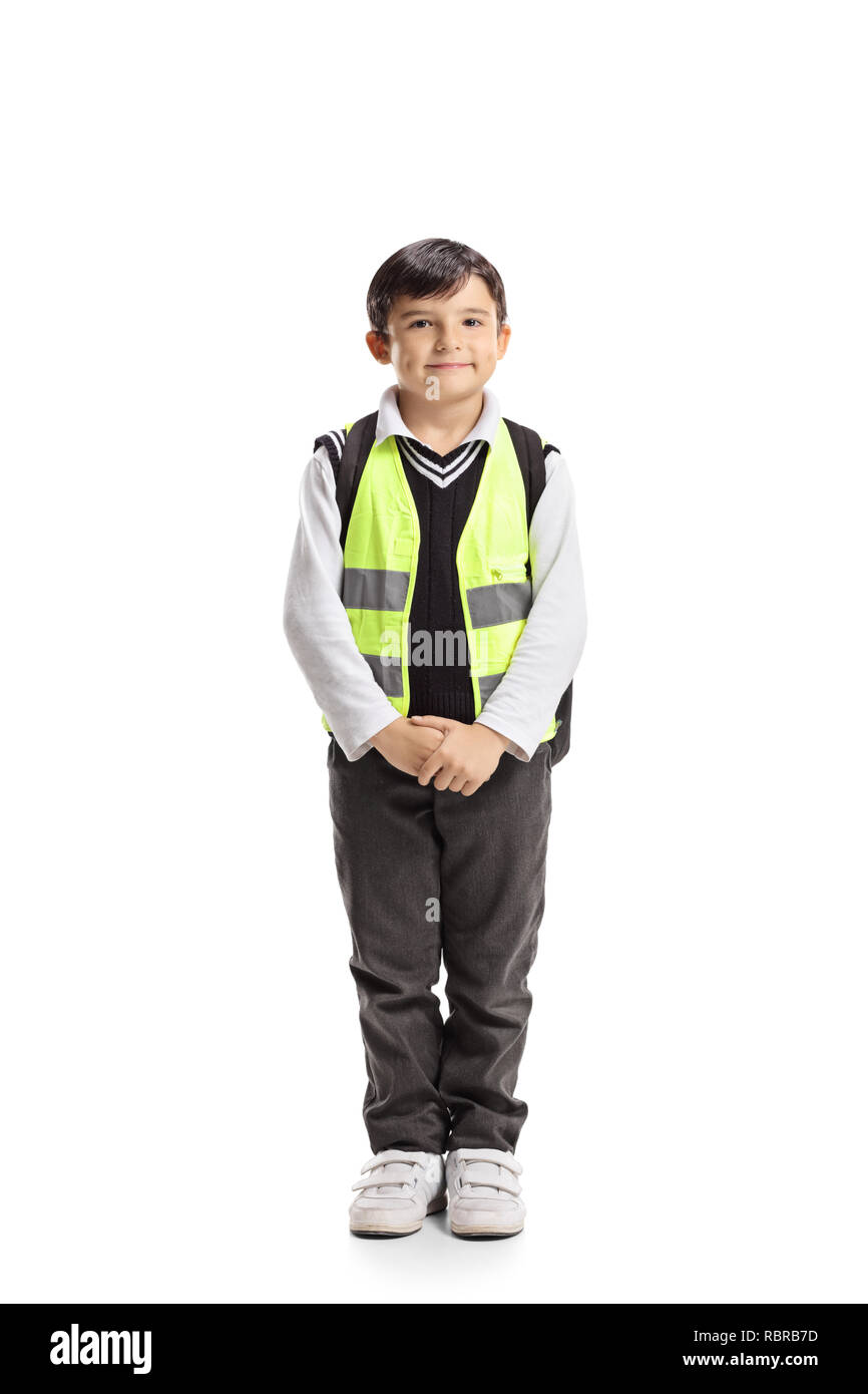 Portrait d'un écolier avec un gilet de sécurité posant isolé sur fond blanc Banque D'Images
