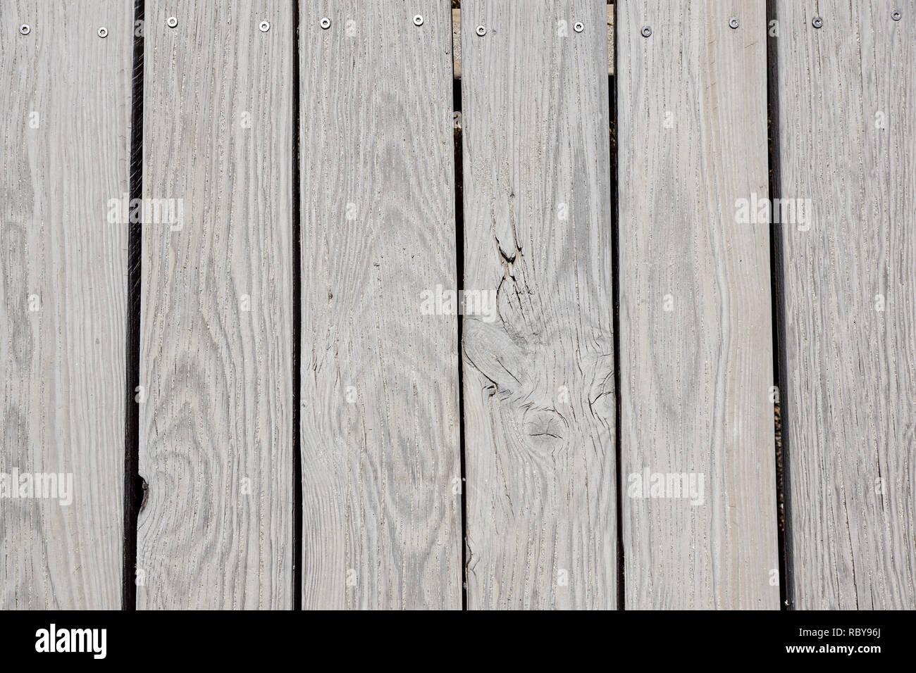 Promenade de la plage en bois avec du sable pour le fond ou la texture. Banque D'Images