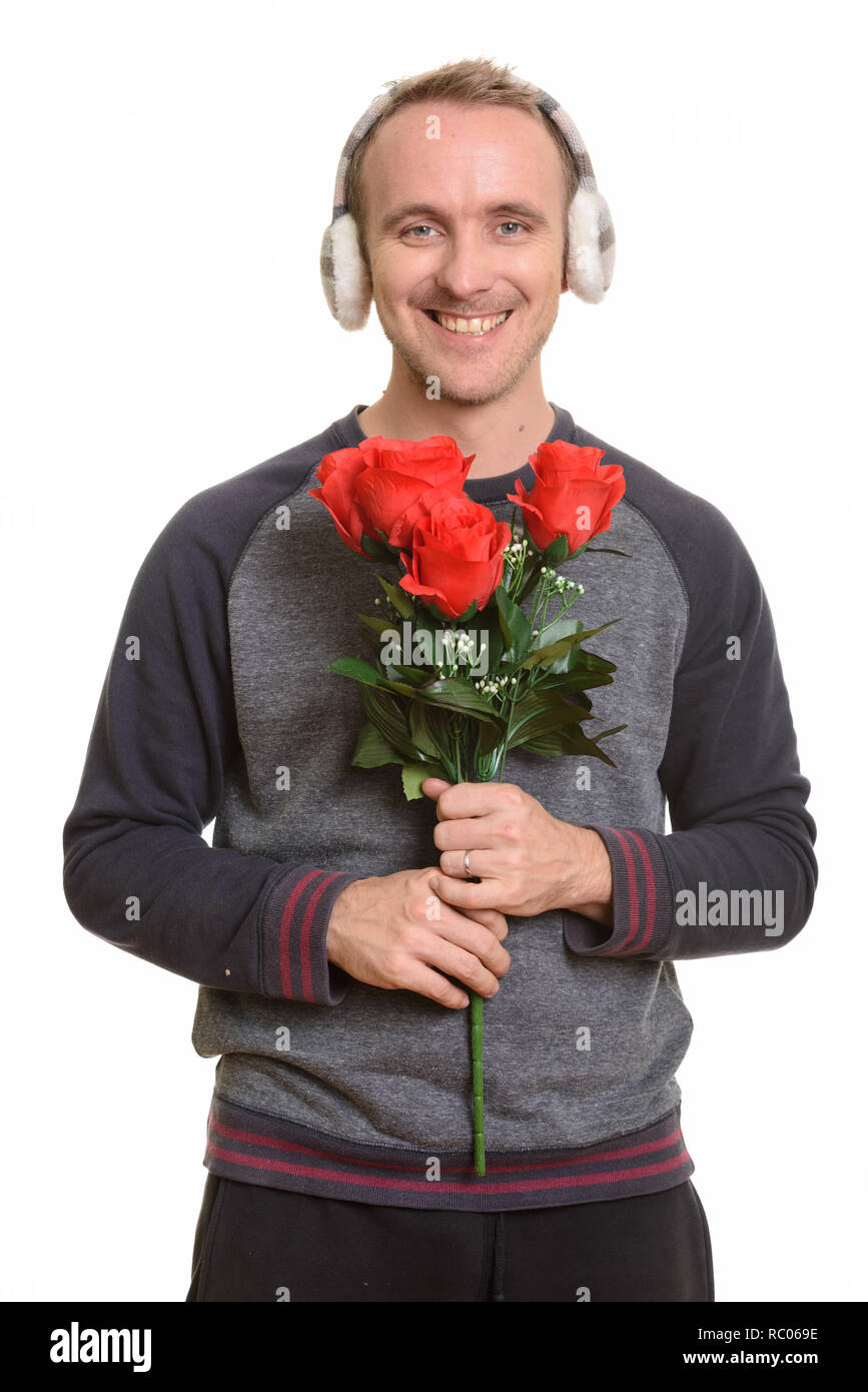 Happy handsome Young man holding red roses prêt pour Valenti Banque D'Images