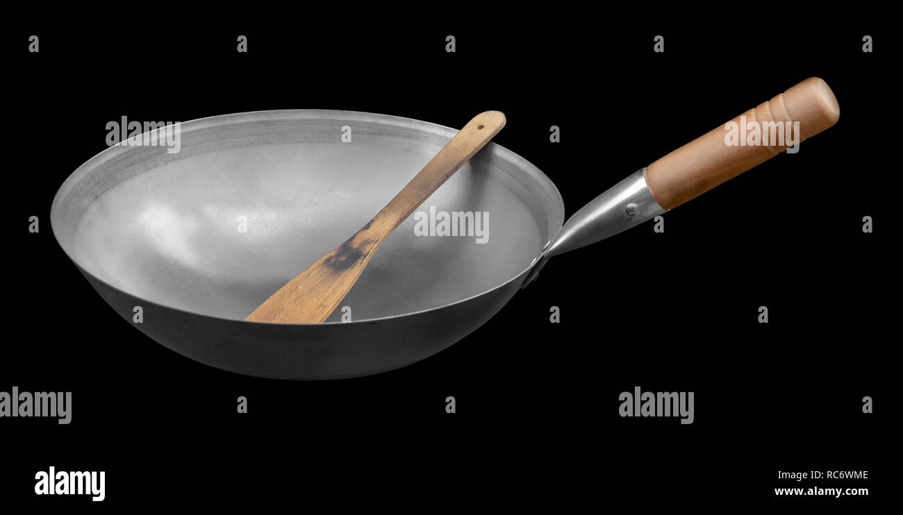 Pan wok isolé dans l'arrière noir Banque D'Images