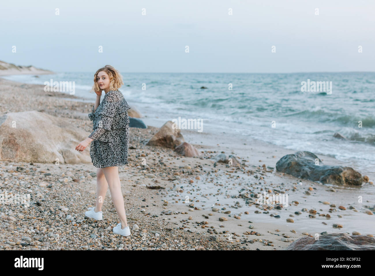 Young woman strolling on beach, portrait, Menemsha, Martha's Vineyard, Massachusetts, USA Banque D'Images