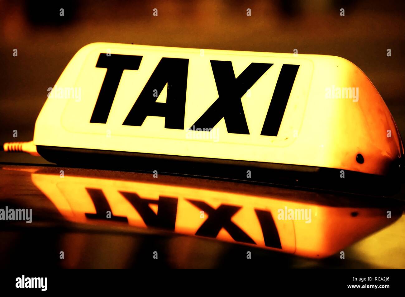 Close up on a yellow taxi cab sign Banque D'Images