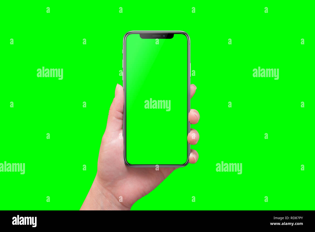 Smart phone moderne dans la main close-up. Fond écran isolé et en vert. Banque D'Images